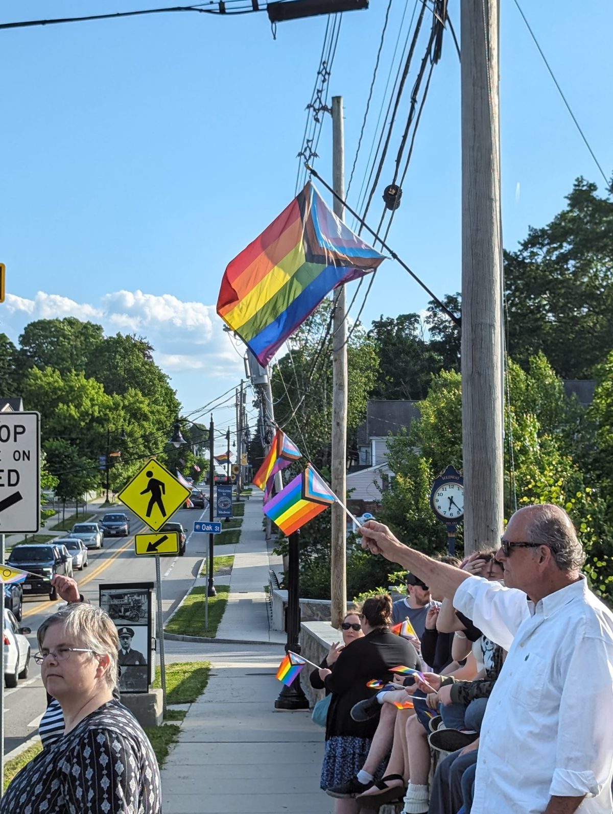 Pride flags being raised on Main Street