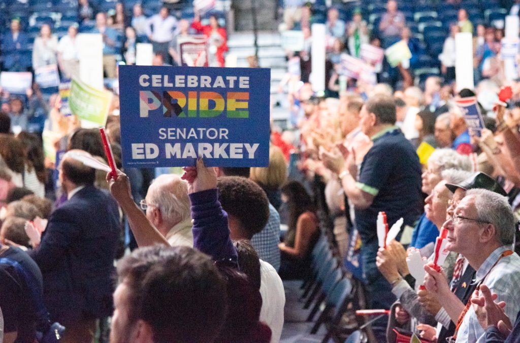 Crowd with Ed Markey rainbow sign saying Celebrate Pride