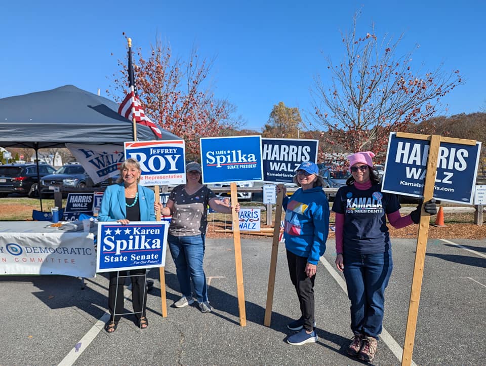 Senate President Karen Spilka and Medway Dems hold signs