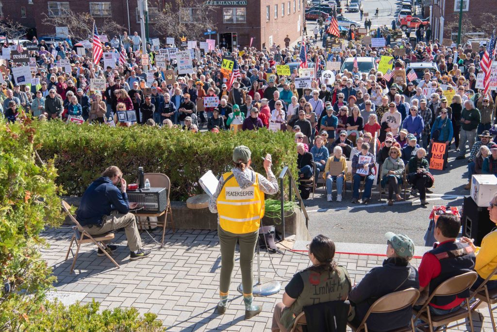 A speaker addresses the crowd.